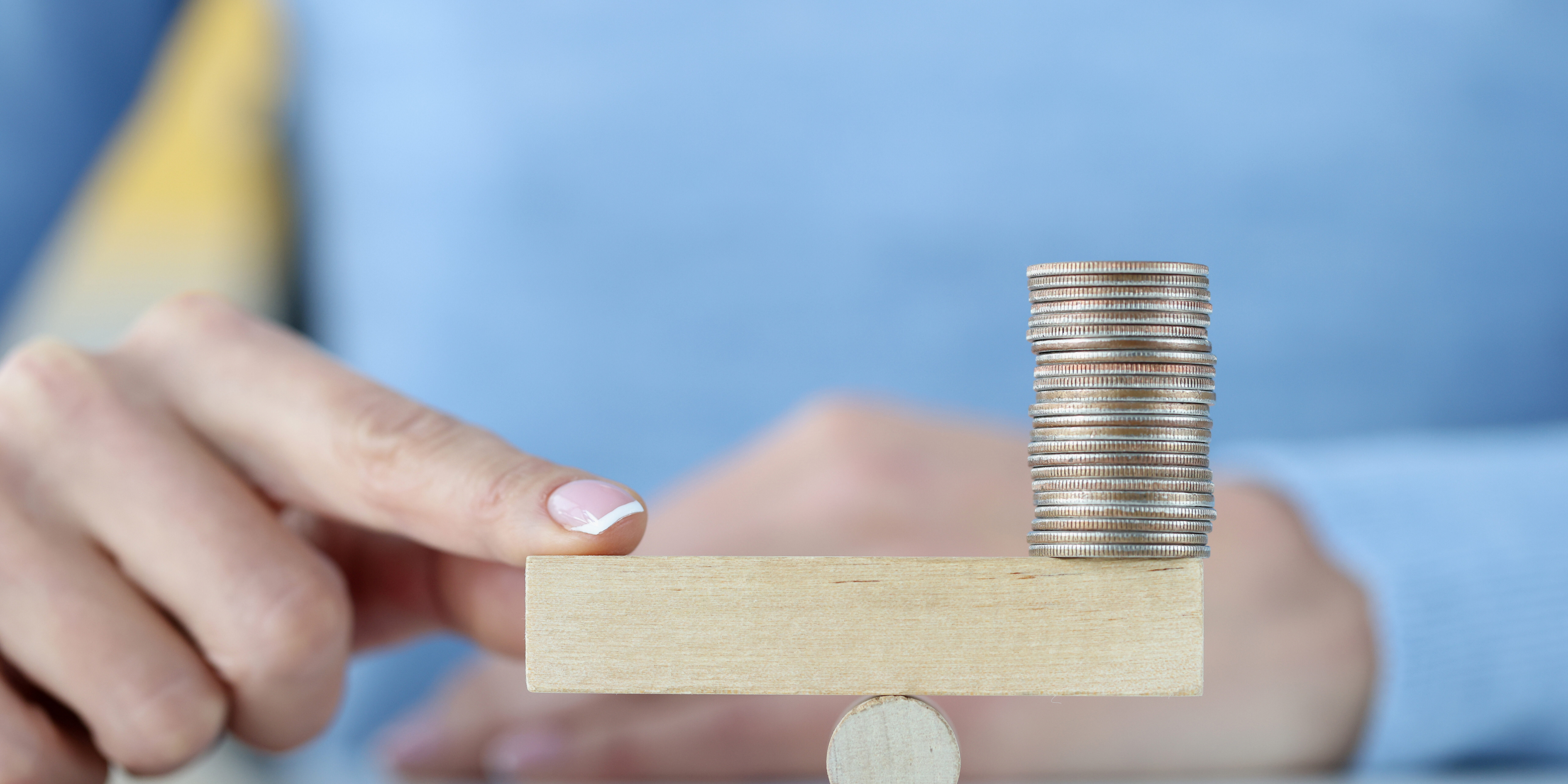 tower-coins-wooden-block-finger-other-side-investment-trading-concept